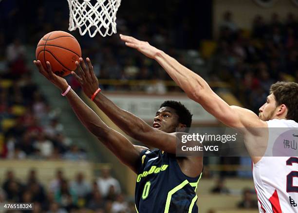 Emmanuel Mudiay of Guangdong Southern Tigers in action during the CBA 14/15 game against Foshan Dralions on November 14, 2014 in Foshan, Guangdong...