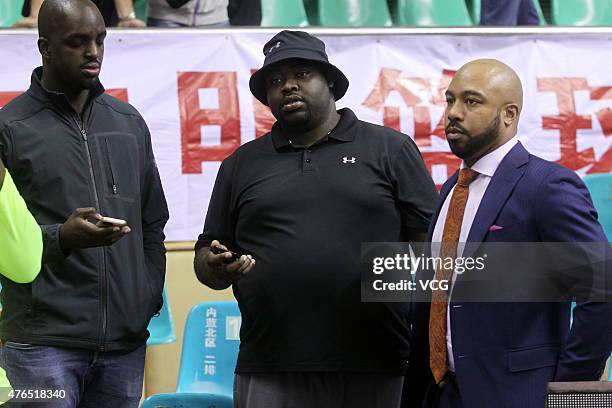 Emmanuel Mudiay's enlightening teacher reacts during the CBA 14/15 game between Guangdong Southern Tigers and Chongqing Fly Dragon on November 19,...