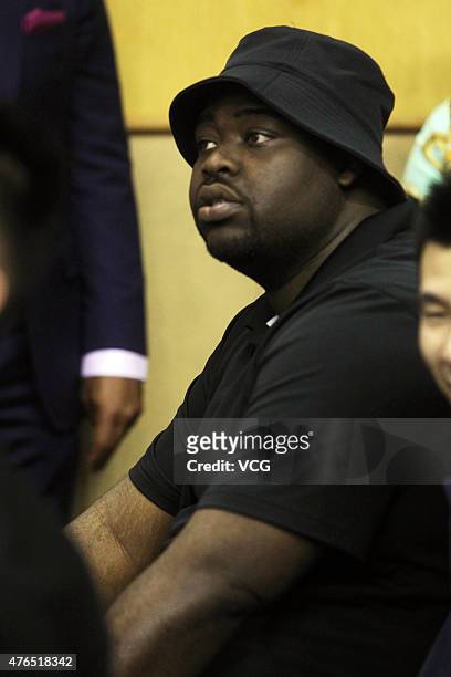 Emmanuel Mudiay's enlightening teacher reacts during the CBA 14/15 game between Guangdong Southern Tigers and Chongqing Fly Dragon on November 19,...
