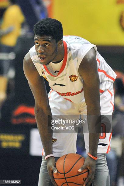 Emmanuel Mudiay of Guangdong Southern Tigers in action during the CBA 14/15 game against Chongqing Fly Dragon on November 19, 2014 in Dongguan,...