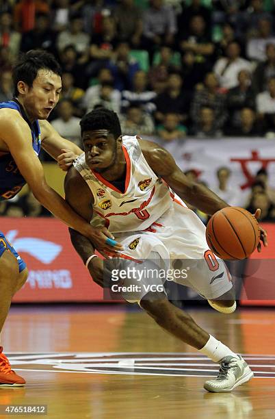 Emmanuel Mudiay of Guangdong Southern Tigers in action during the CBA 14/15 game against Sichuan Jinqiang on November 16, 2014 in Dongguan, Guangdong...