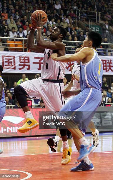 Emmanuel Mudiay of Guangdong Southern Tigers in action during the CBA 14/15 game against Shandong Hi-speed on November 7, 2014 in Dongguan, Guangdong...