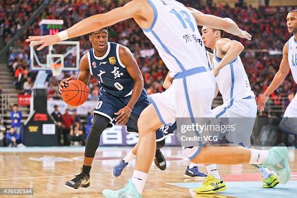 Emmanuel Mudiay of Guangdong Southern Tigers in action during the CBA 14/15 game against Beijing Ducks on November 1, 2014 in Beijing, China.