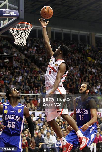 Emmanuel Mudiay of Guangdong Southern Tigers in action during the CBA 14/15 game against Qingdao Doublestar on November 9, 2014 in Dongguan,...