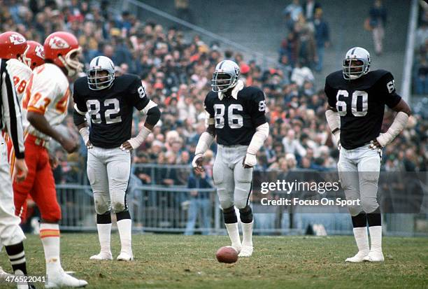 Otis Sistrunk, Gerald Irons, and Horace Jones of the Oakland Raiders looks on against the Kansas City Chiefs during an NFL Football game December 21,...