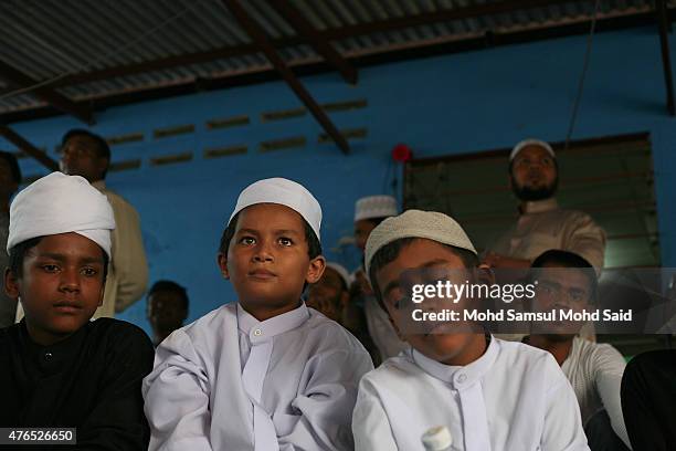 Muslim Rohingyas living in Malaysia listen the conference during a day of commemoration to remember the 2012 Rohingya genocide on June 10, 2015 in...