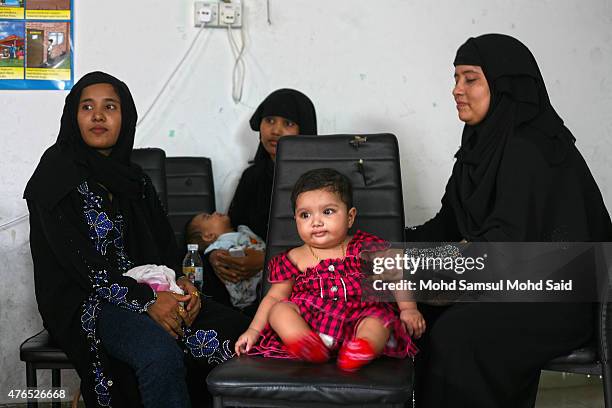 Muslim womens Rohingyas living in Malaysia is seen seat inside the hall during a day of commemoration to remember the 2012 Rohingya genocide on June...