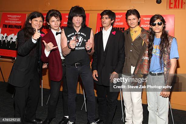 Musician Marky Ramone poses with 'The Wolfpack' aka Angulo brothers at 'The Wolfpack' New York premiere at Sunshine Landmark on June 9, 2015 in New...