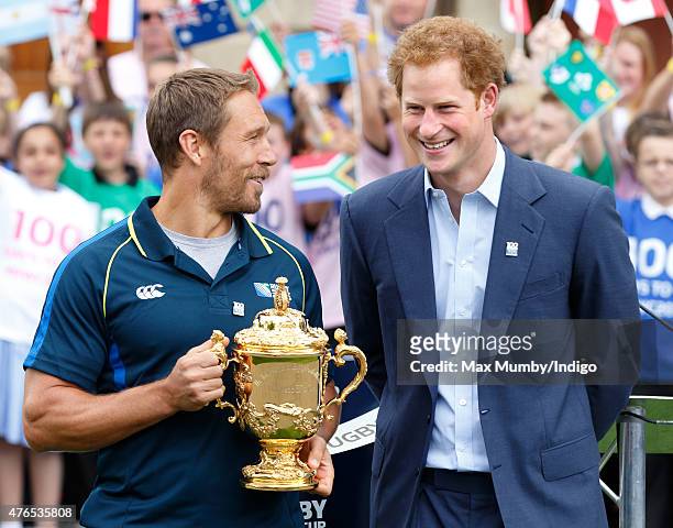 Jonny Wilkinson holds the Webb Ellis Cup as he and Prince Harry attend the launch of the Rugby World Cup Trophy Tour, 100 days before the Rugby World...