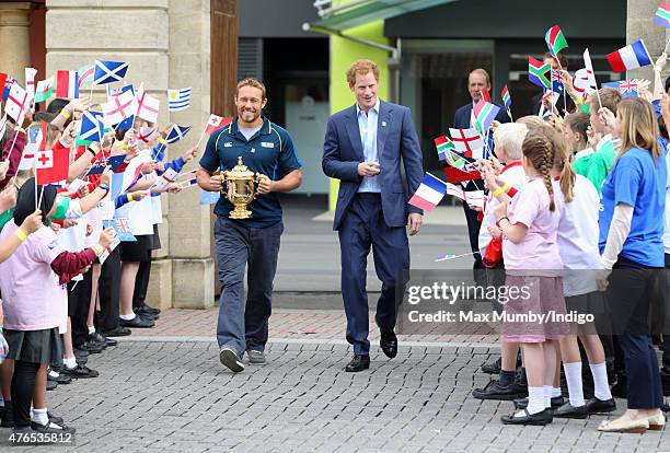 Jonny Wilkinson holds the Webb Ellis Cup as he and Prince Harry attend the launch of the Rugby World Cup Trophy Tour, 100 days before the Rugby World...