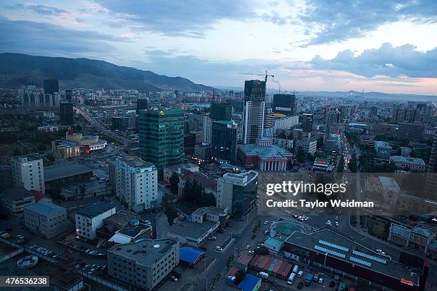 View of downtown Ulaanbaatar from the Blue Sky Tower at dusk on June 10, 2015 in Ulaanbaatar, Mongolia. A few years ago, Mongolia boasted one of the...