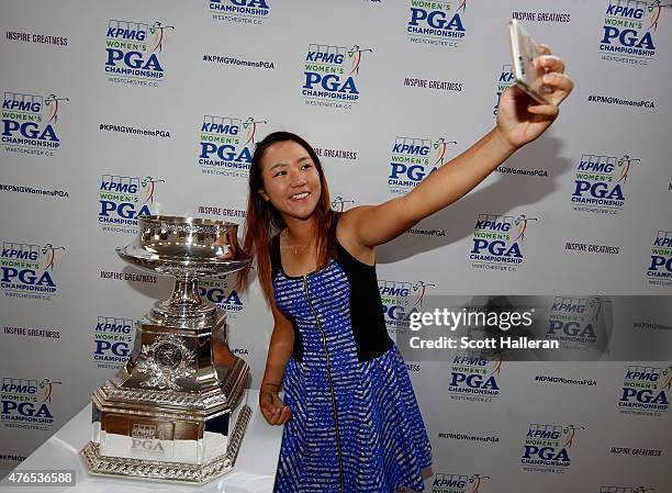 Lydia Ko of New Zealand poses for a smart phone photo after the pro-am, prior to the start of the KPMG Women's PGA Championship on the West Course at...