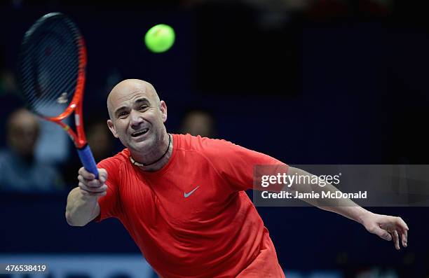 Andre Agassi in action during his match against Pete Sampras during the World Tennis Day London Showdown press conference at the Athenaeum Hotel at...