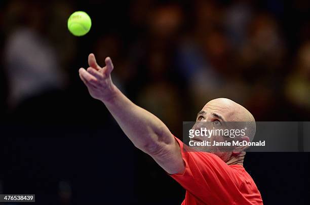 Andre Agassi in action during his match against Pete Sampras during the World Tennis Day London Showdown press conference at the Athenaeum Hotel at...