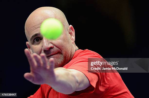 Andre Agassi in action during his match against Pete Sampras during the World Tennis Day London Showdown press conference at the Athenaeum Hotel at...