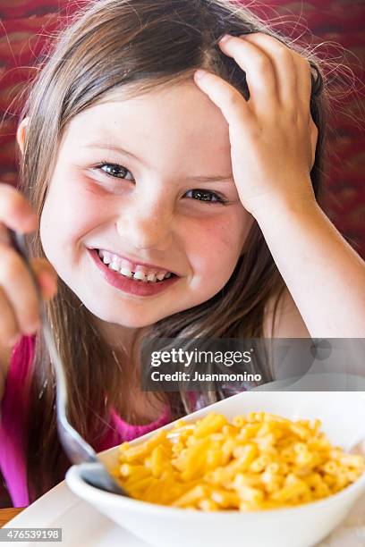 having macaroni and cheese - mac and cheese stock pictures, royalty-free photos & images