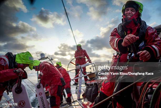 In this handout image provided by the Volvo Ocean Race, onboard Dongfeng Race Team. Martin Strmberg shows the hard work involved with tacking in 30...