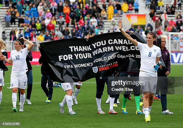 The England team salutes the fans after the match against France during the FIFA Women's World Cup 2015 Group F match at Moncton Stadium on June 9,...