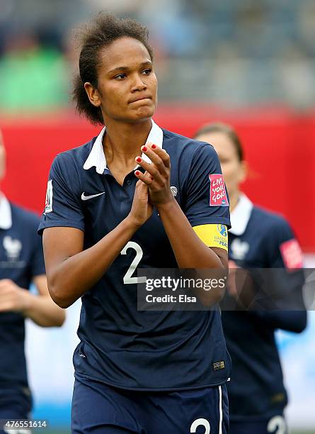 Wendie Renard of France salutes the fans after the match against England during the FIFA Women's World Cup 2015 Group F match at Moncton Stadium on...