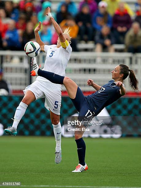 Gaetane Thiney of France clears the ball before Steph Houghton of England can reach it during the FIFA Women's World Cup 2015 Group F match at...