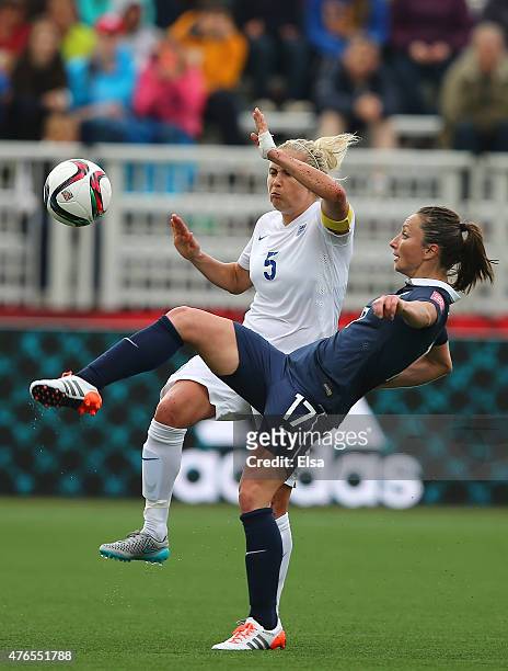 Gaetane Thiney of France clears the ball before Steph Houghton of England can reach it during the FIFA Women's World Cup 2015 Group F match at...
