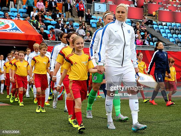 Steph Houghton of England leads the team out before the match against France during the FIFA Women's World Cup 2015 Group F match at Moncton Stadium...