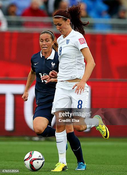 Jill Scott of England takes the ball as Camille Abily of France defends during the FIFA Women's World Cup 2015 Group F match at Moncton Stadium on...