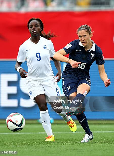 Elise Bussaglia of France passes the ball before Eniola Aluko of England can make the steal during the FIFA Women's World Cup 2015 Group F match at...