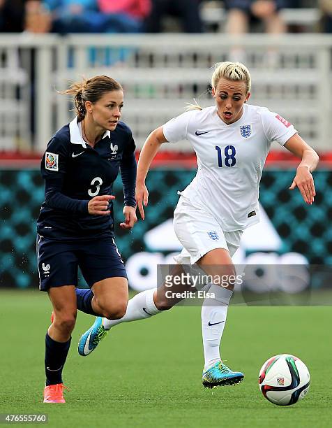 Toni Duggan of England and Laure Boulleau of France fight for the ball during the FIFA Women's World Cup 2015 Group F match at Moncton Stadium on...