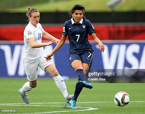 Kenza Dali of France passes the ball as Jade Moore of England defends during the FIFA Women's World Cup 2015 Group F match at Moncton Stadium on June...