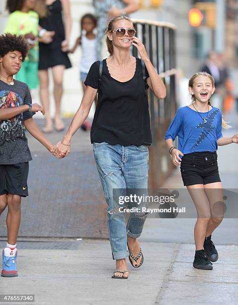 Model Heidi Klum,Henry Gunther Ademola Dashtu Samuel,Helene Boshoven Samuel are seen in Tribeca on June 9, 2015 in New York City.