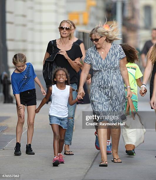Model Heidi Klum,Henry Gunther Ademola Dashtu Samuel,Helene Boshoven Samuel are seen in Tribeca on June 9, 2015 in New York City.