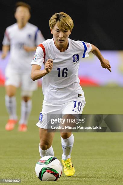 Kang Yumi of Korea Republic moves the ball during the 2015 FIFA Women's World Cup Group E match against Brazil at Olympic Stadium on June 9, 2015 in...