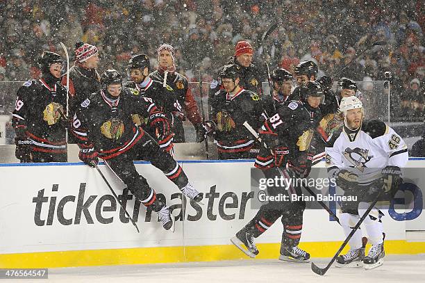 Brandon Saad and Marian Hossa of the Chicago Blackhawks jump on the ice for a line change during the 2014 NHL Stadium Series game against the...