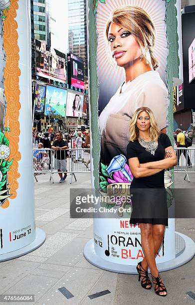 Laverne Cox from the cast of the hit Netflix original series "ORANGE IS THE NEW BLACK" keeps the faith at a giant 14 foot tall candle-shaped photo...