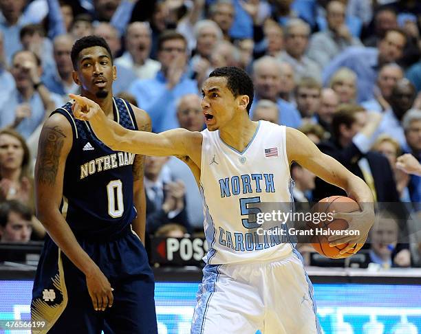 Marcus Paige of the North Carolina Tar Heels reacts during the final seconds of a win over Eric Atkins and the Notre Dame Fighting Irish during a...