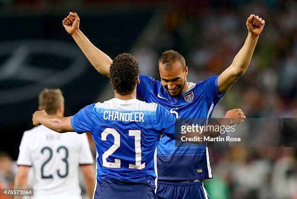Timmy Chandler of USA celebrate with team mate John Brooks after the International Friendly match between Germany and USA at RheinEnergieStadion on...