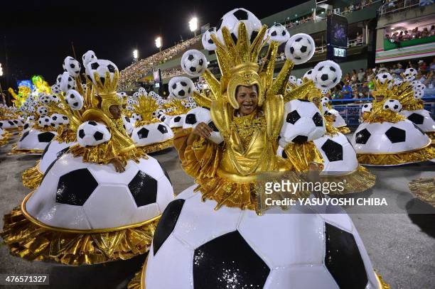Revelers of the Uniao da Ilha samba school perform during the second night of carnival parade at the Sambadrome in Rio de Janeiro, Brazil on March 3,...