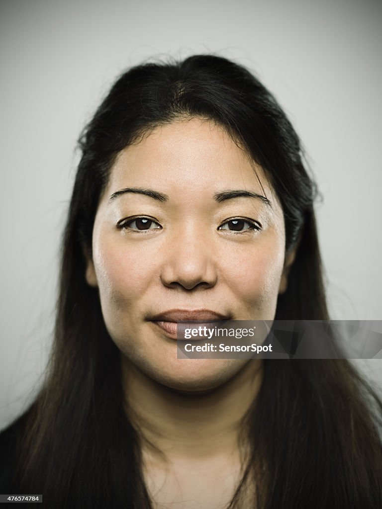 Portrait of a young japanese woman looking at camera
