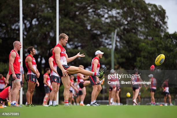 Ryan O'Keefe of the Swans kicks a ball during a Sydney Swans AFL training session at Lakeside Oval on March 4, 2014 in Sydney, Australia.