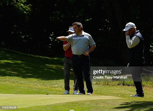 Mark Sparrow of Halfpenny Green Golf Club and Matt McGuire of Little Lakes Golf Club discuss their putt on the 8th green during the Golfbreaks.com...