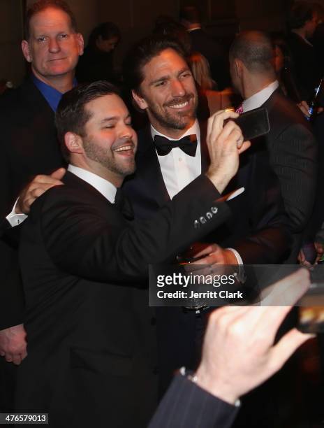 Rangers goalie Henrik Lundqvist poses for a photo with a fan at the 2014 New York Rangers Casino Night To Benefit The Garden Of Dreams Foundation at...