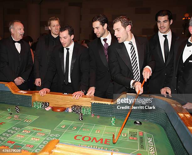 Rangers players Marc Staal, Ryan Callahan, Cam Talbot, Dan Girardi and Brian Boyle play craps at the the 2014 New York Rangers Casino Night To...