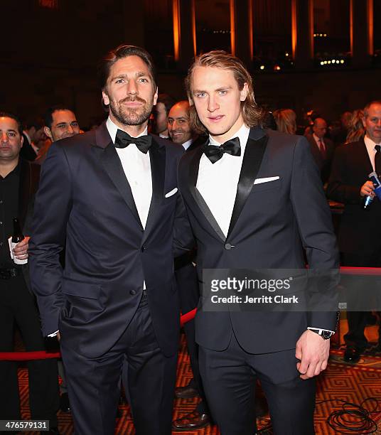 Rangers and Team Sweden hockey teammates Henrik Lundqvist and Carl Hagelin attends the 2014 New York Rangers Casino Night To Benefit The Garden Of...