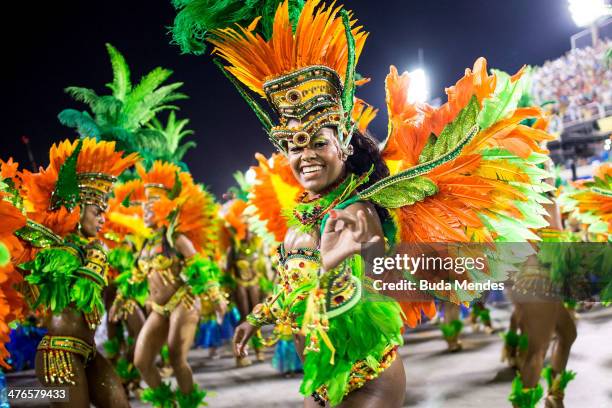 Members of Vila Isabel samba school perform during its parade at 2014 Brazilian Carnival at Sapucai Sambadrome on March 03, 2014 in Rio de Janeiro,...
