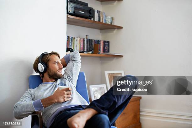 time to unwind with some music... - home relaxation stock pictures, royalty-free photos & images