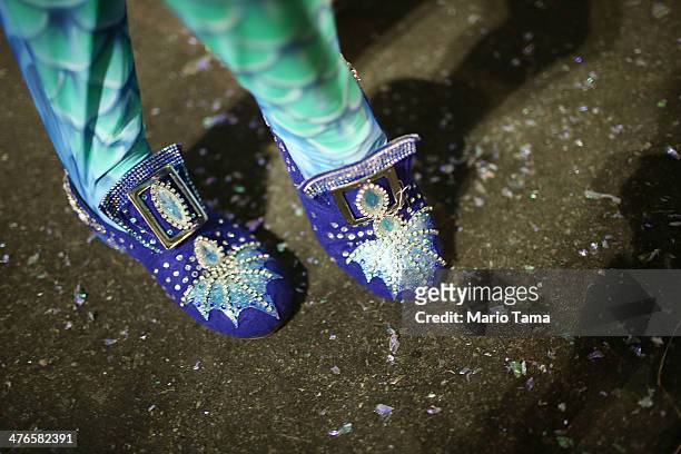 Performer stands before the start of the Portela samba school parade at 2014 Brazilian Carnival at Sapucai Sambadrome on March 03, 2014 in Rio de...
