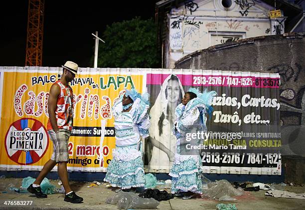 Members gather before the start of the Portela samba school parade at 2014 Brazilian Carnival at Sapucai Sambadrome on March 03, 2014 in Rio de...