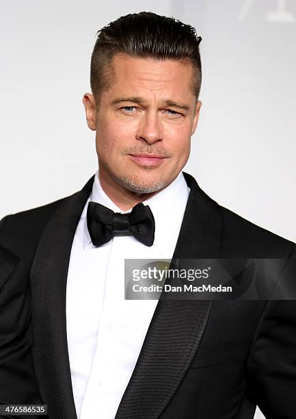 Producer/actor Brad Pitt, winner of Best Picture for '12 Years a Slave,' poses in the press room at the 86th Annual Academy Awards at Hollywood &...