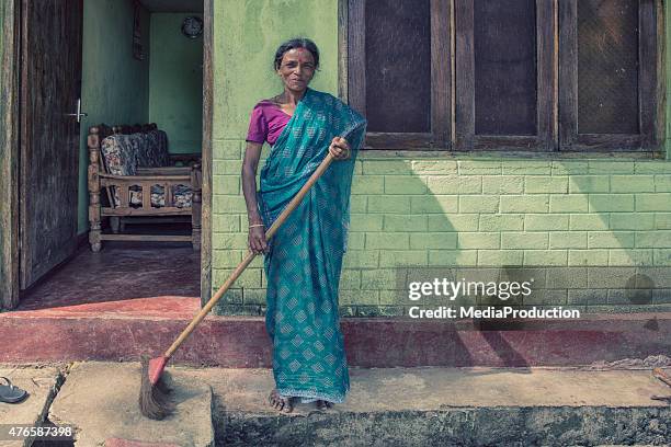 indian woman living in a slum  infront of her house - indian slums stock pictures, royalty-free photos & images